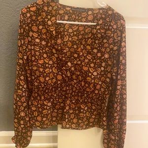 Sheer black floral smocked peplum top